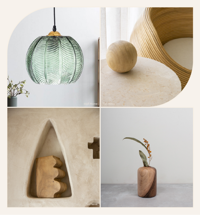 Four biophilic interior details: a green ribbed glass pendant lamp, a wood sphere on a curved rattan console, a carved wood object set in a plaster niche, and a small bud vase with a single sprig