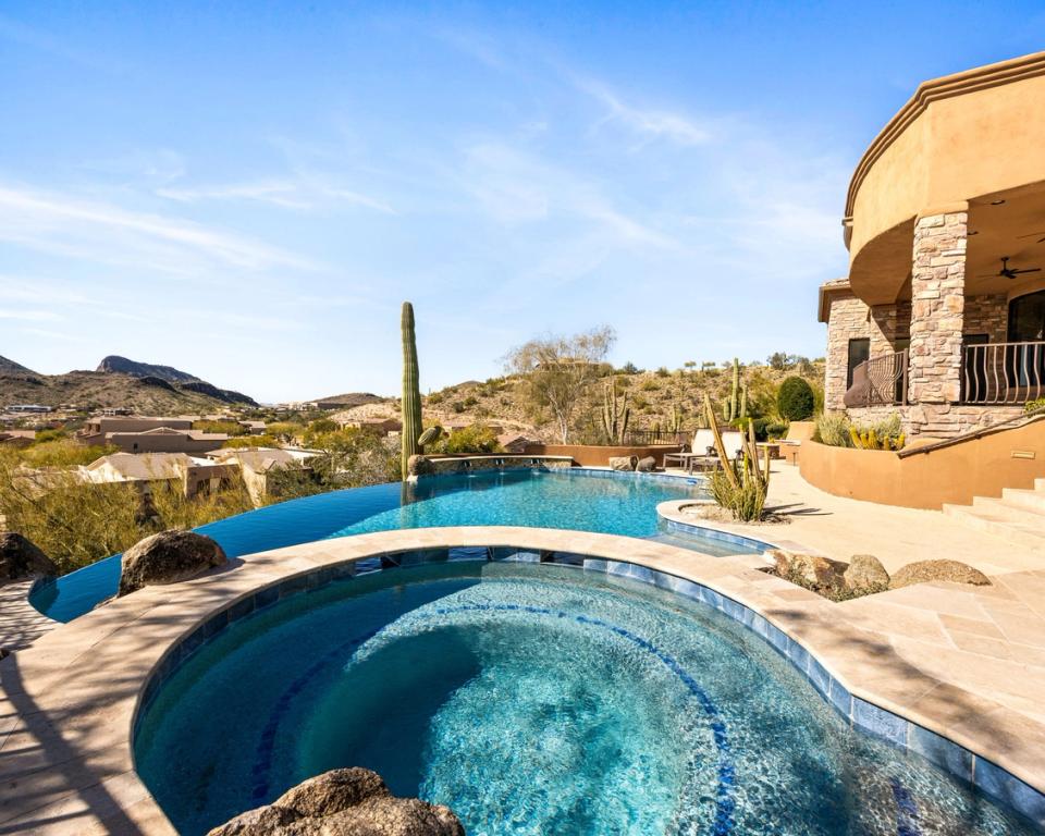 Luxury Home in Fountain Hills FireRock Country Club. backyard negative edge pool.