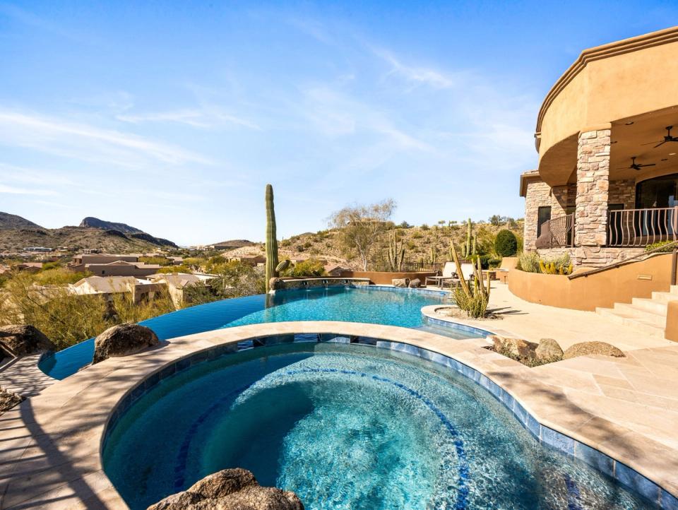 Luxury Home in Fountain Hills FireRock Country Club. backyard negative edge pool.