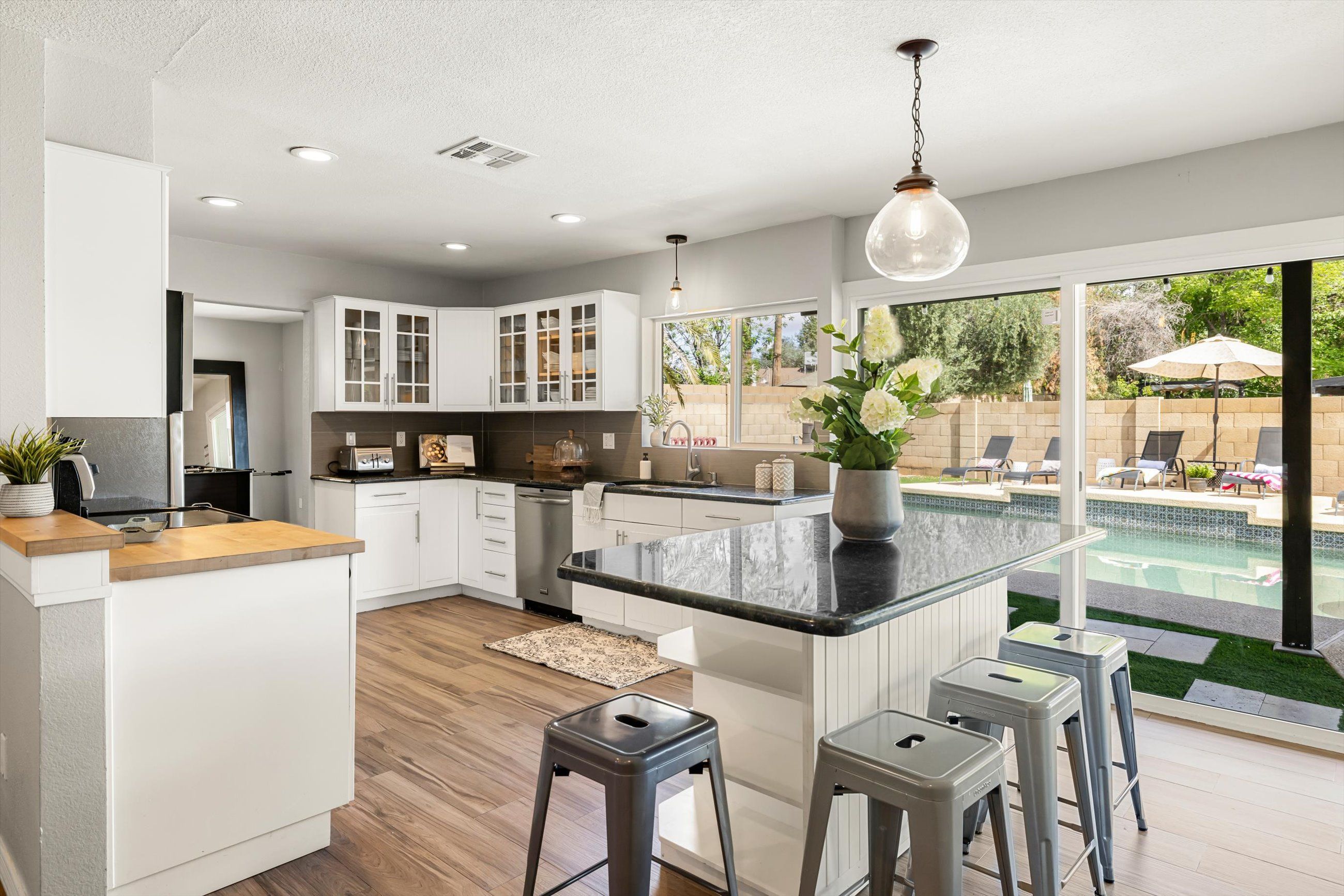 Kitchen with central island and glass sliders