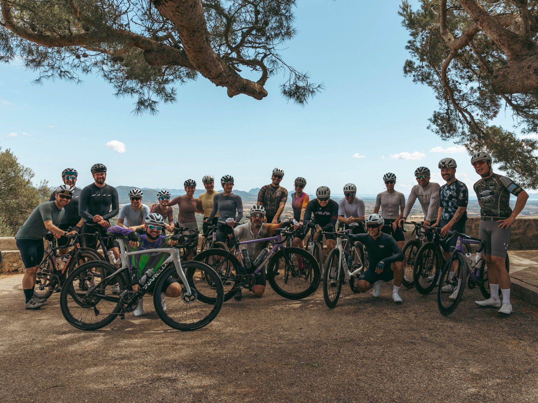 DVX Mallorca Cyclists in a group on top of a climb in mallorca