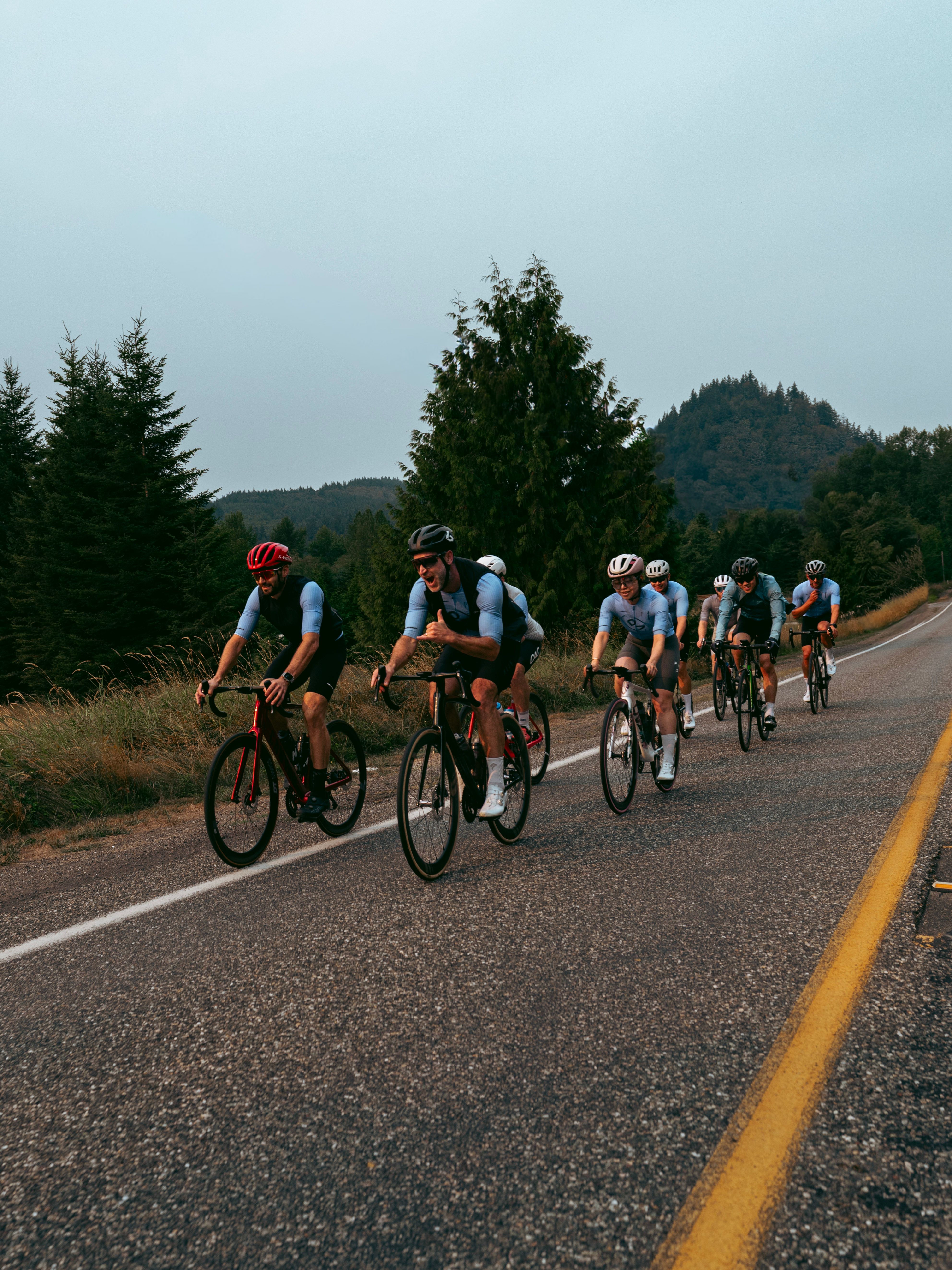 Cyclists in a line wearing the Diversion Cycling Jersey