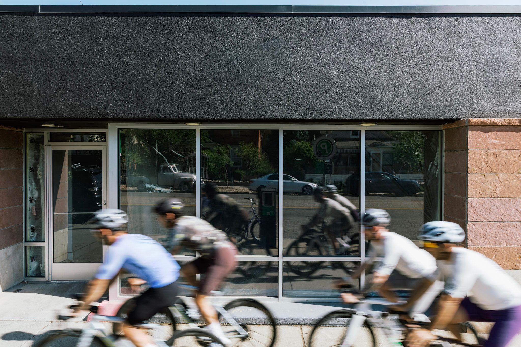 Cyclists riding past the new Enroute store in Boulder, Colorado