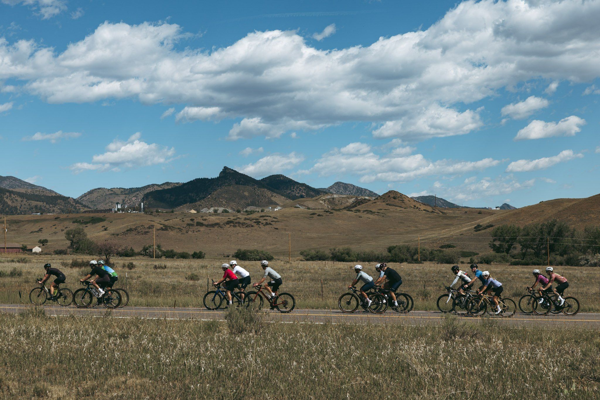 Group cycling through high desert valley