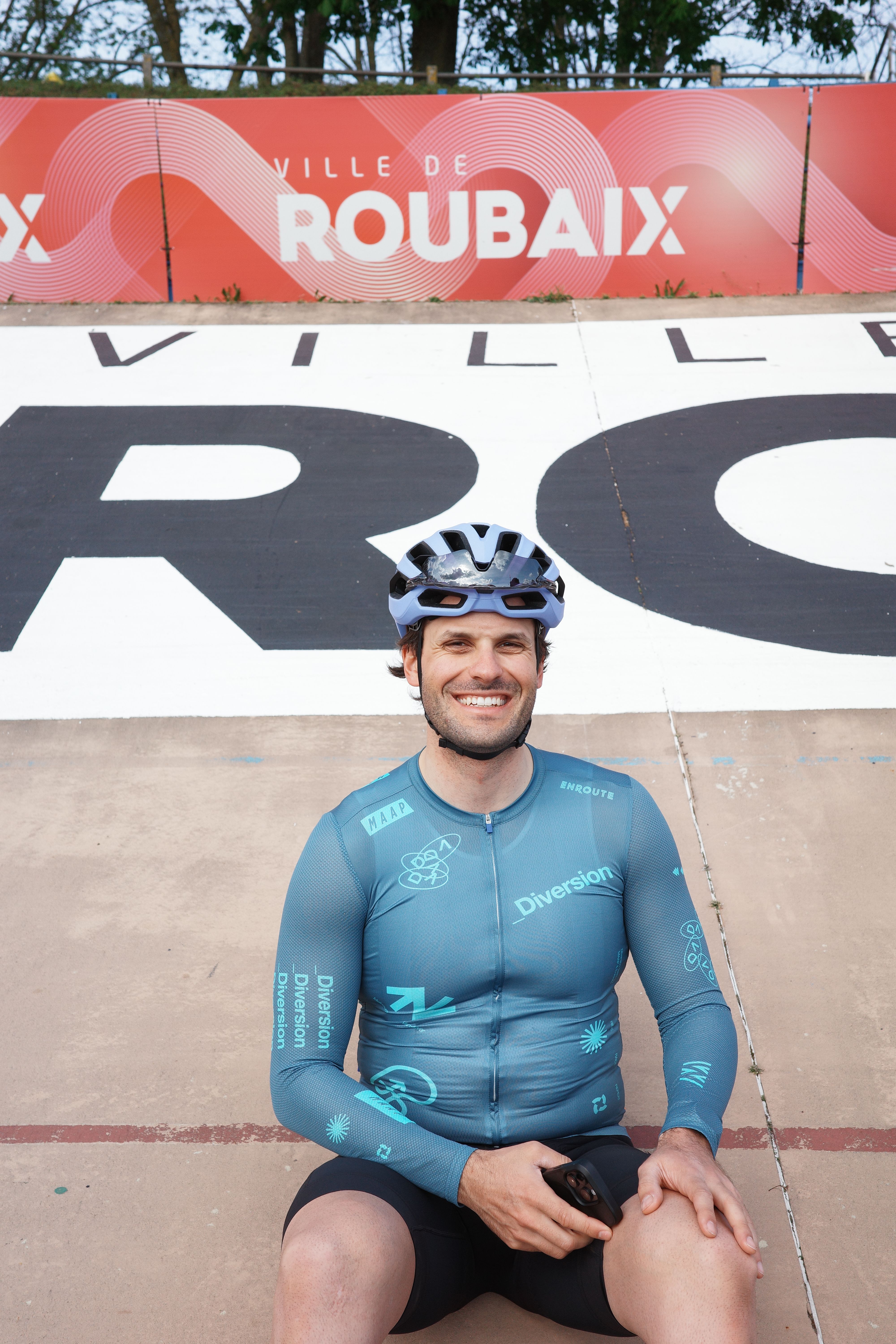 Cyclist sitting in Paris Roubaix velodrome