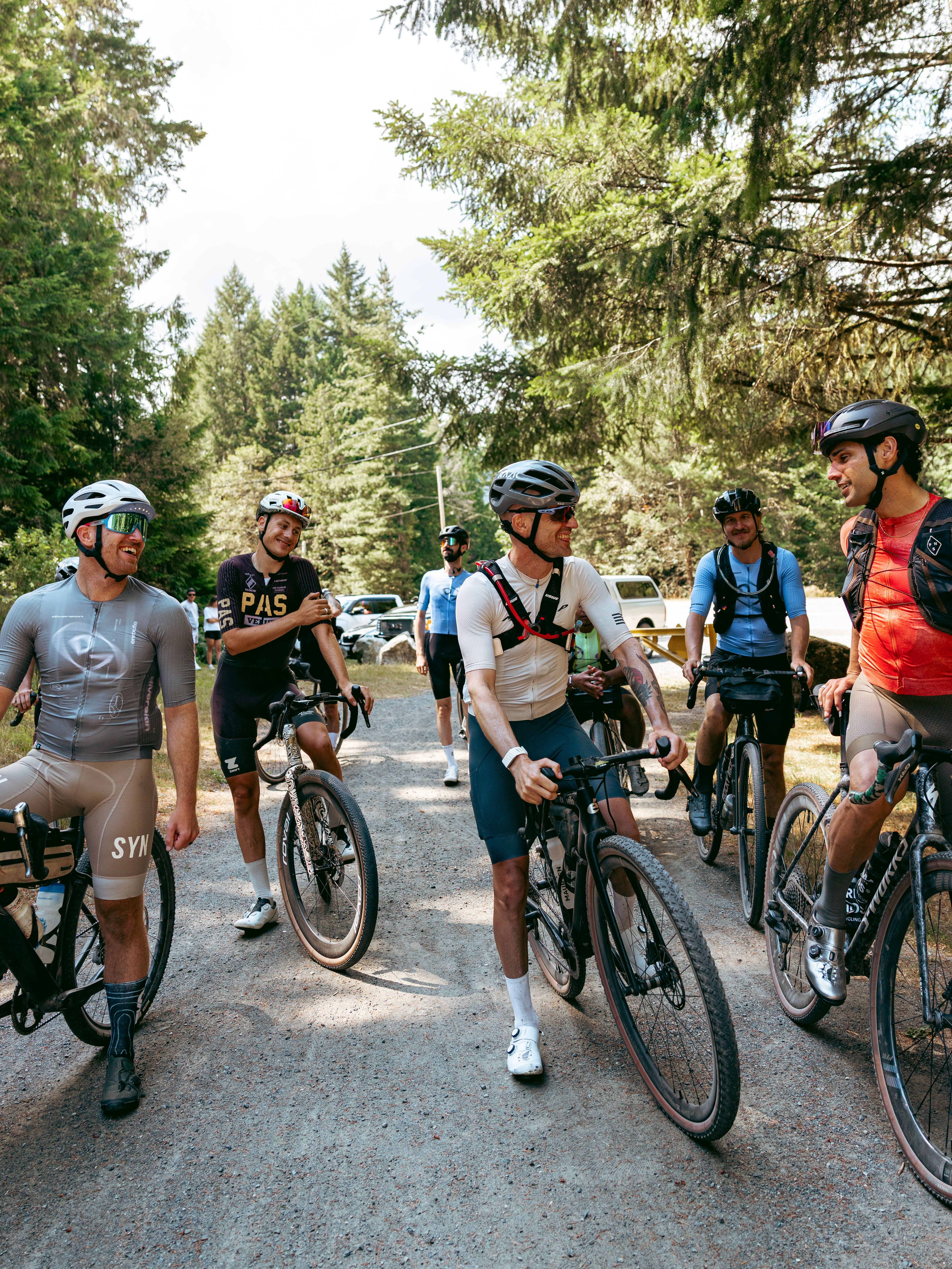 Cyclists standing around in gravel bikes