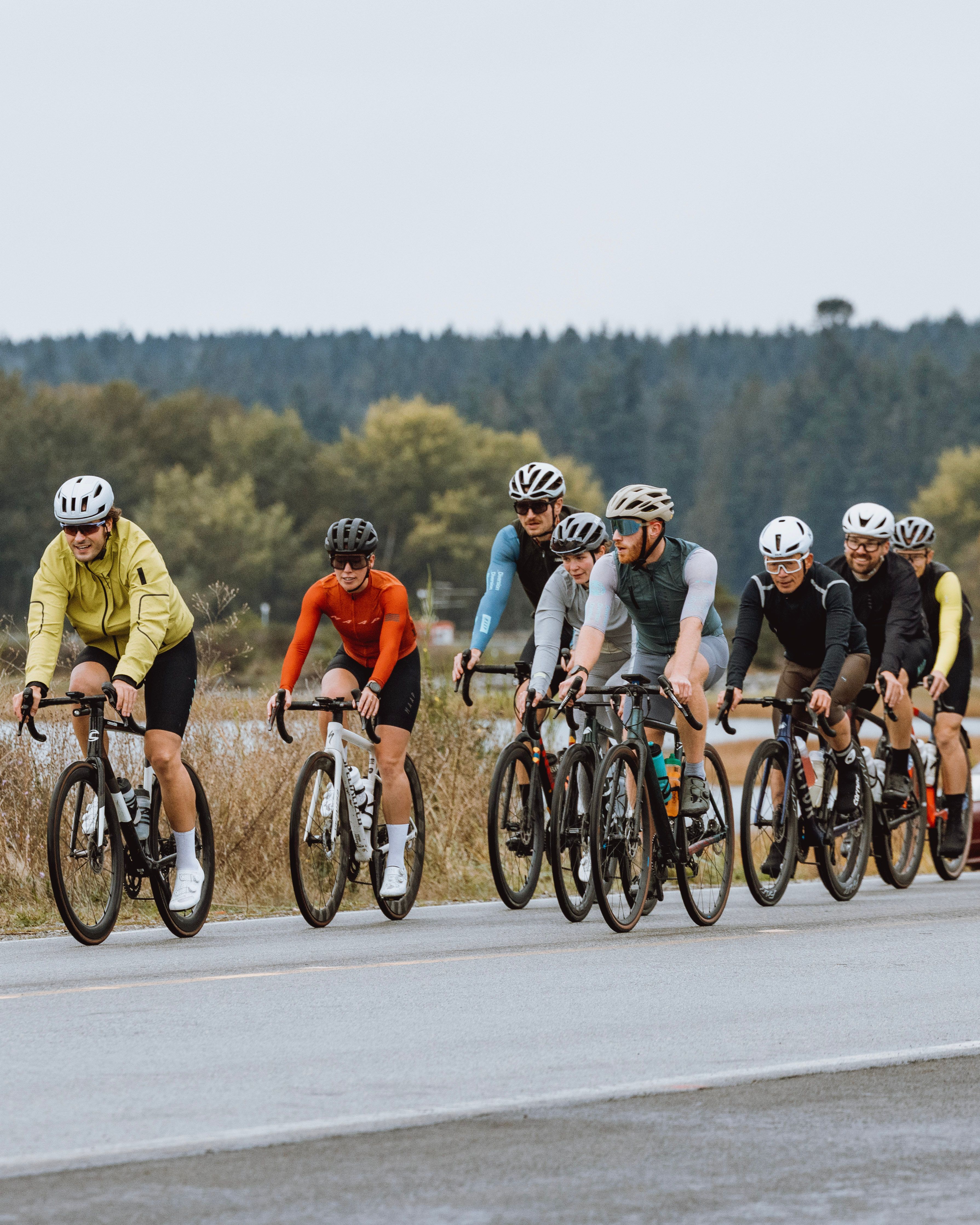 Cyclists on road bikes and grey skies