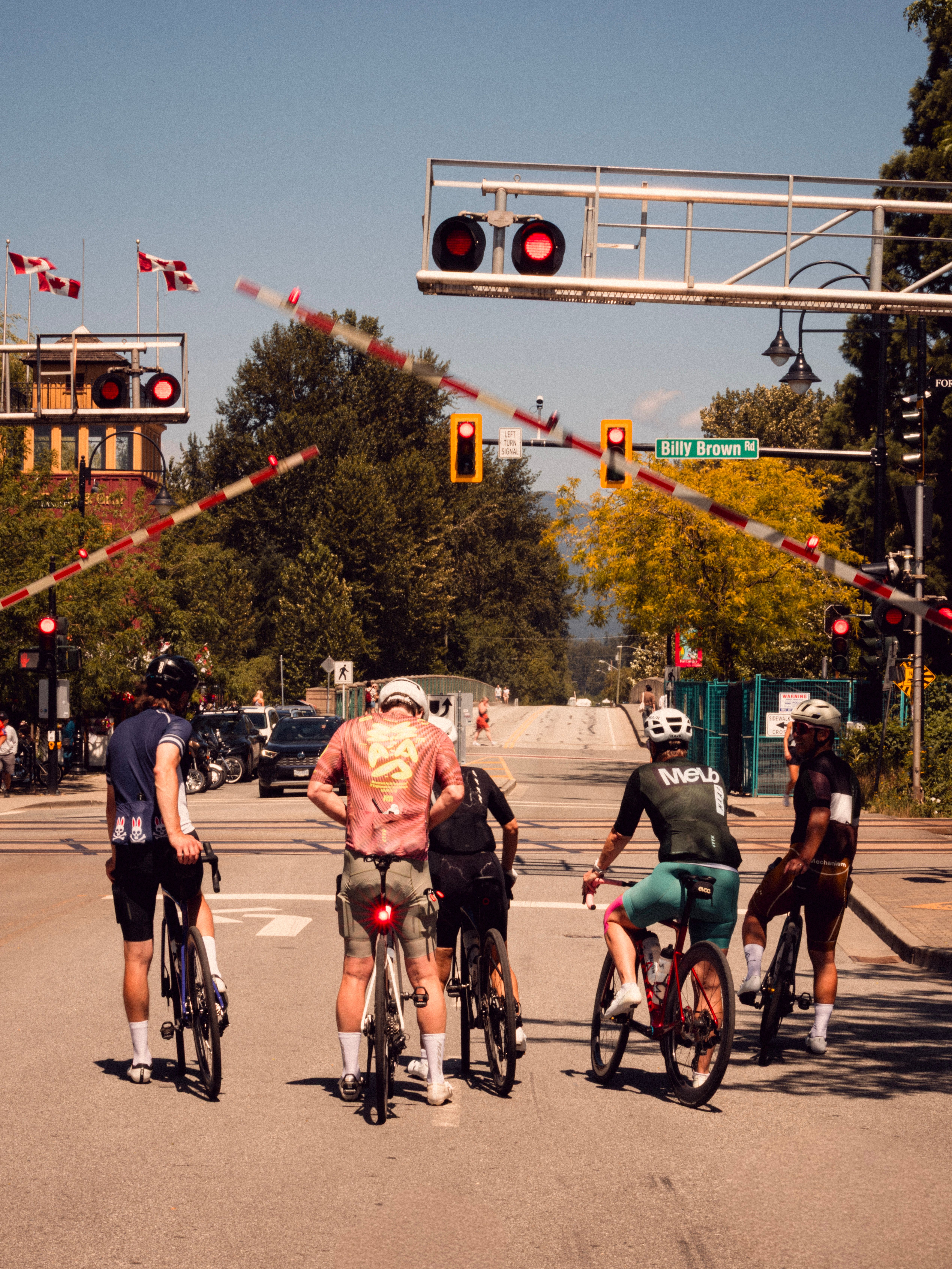 Cyclists in front of closing train guard