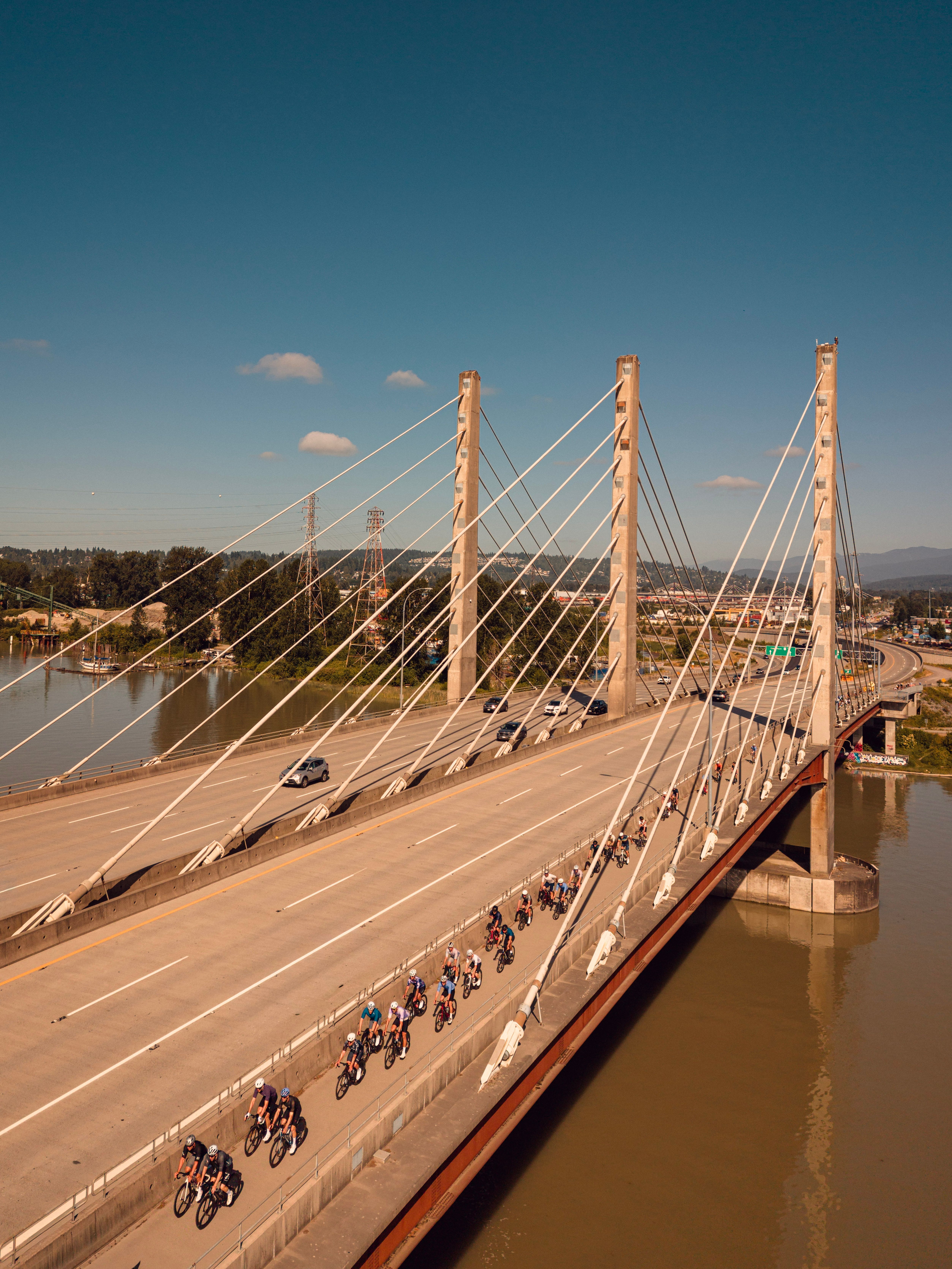 Group of Cyclists riding over Pit River bridge