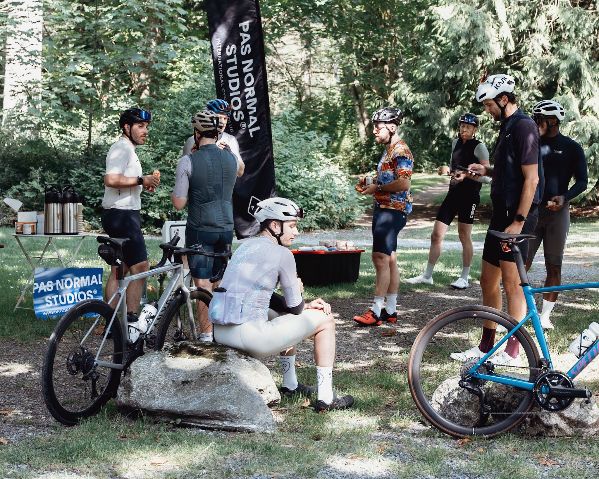 Group of cyclists on a rest stop during a Pas Normal Studios community ride. 
