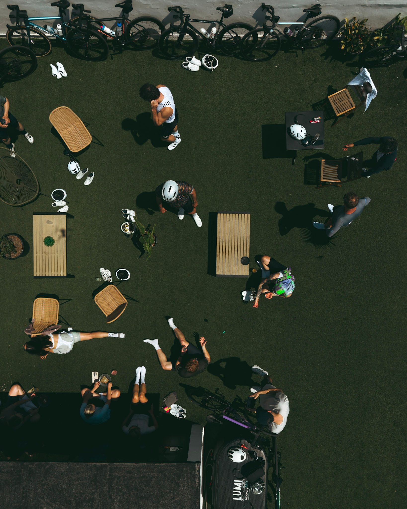 Drone view of Cyclists hanging out on the rooftop of Micelio Organic Coffee and Brunch