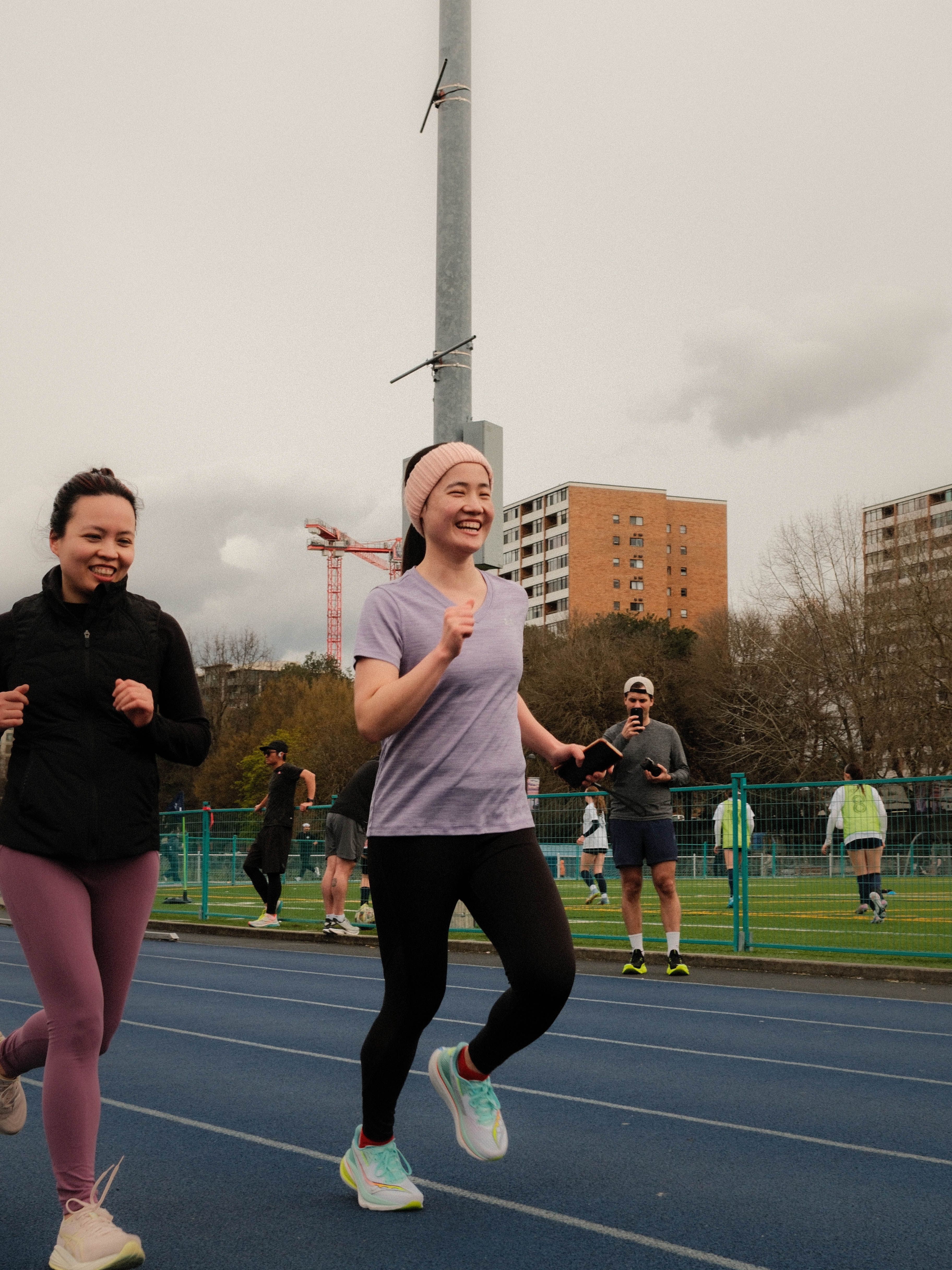 Woman running wearing Saucony Endorphin Line
