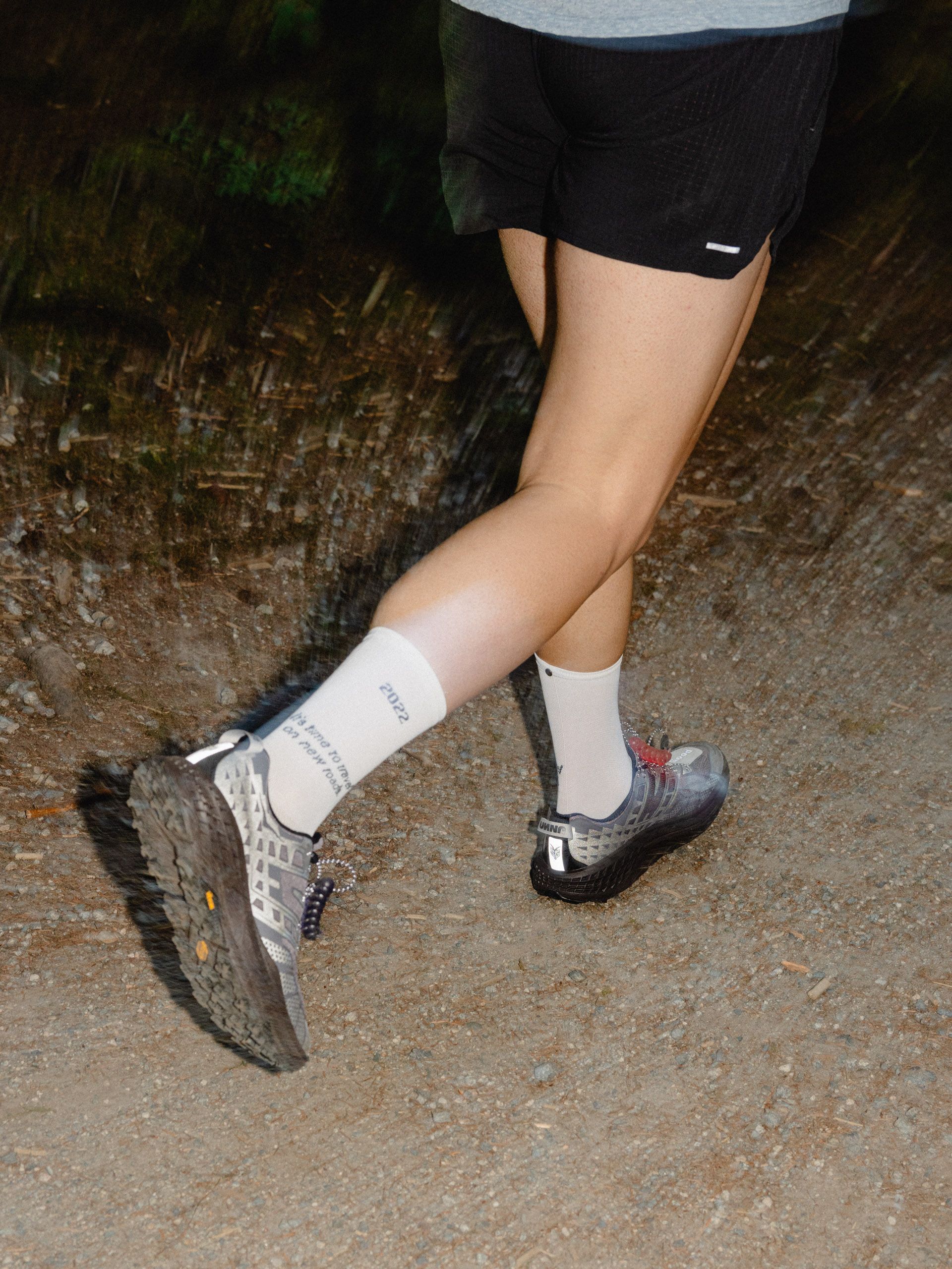An individual running in a Hoka x Unna Speedgoat 2 Unna