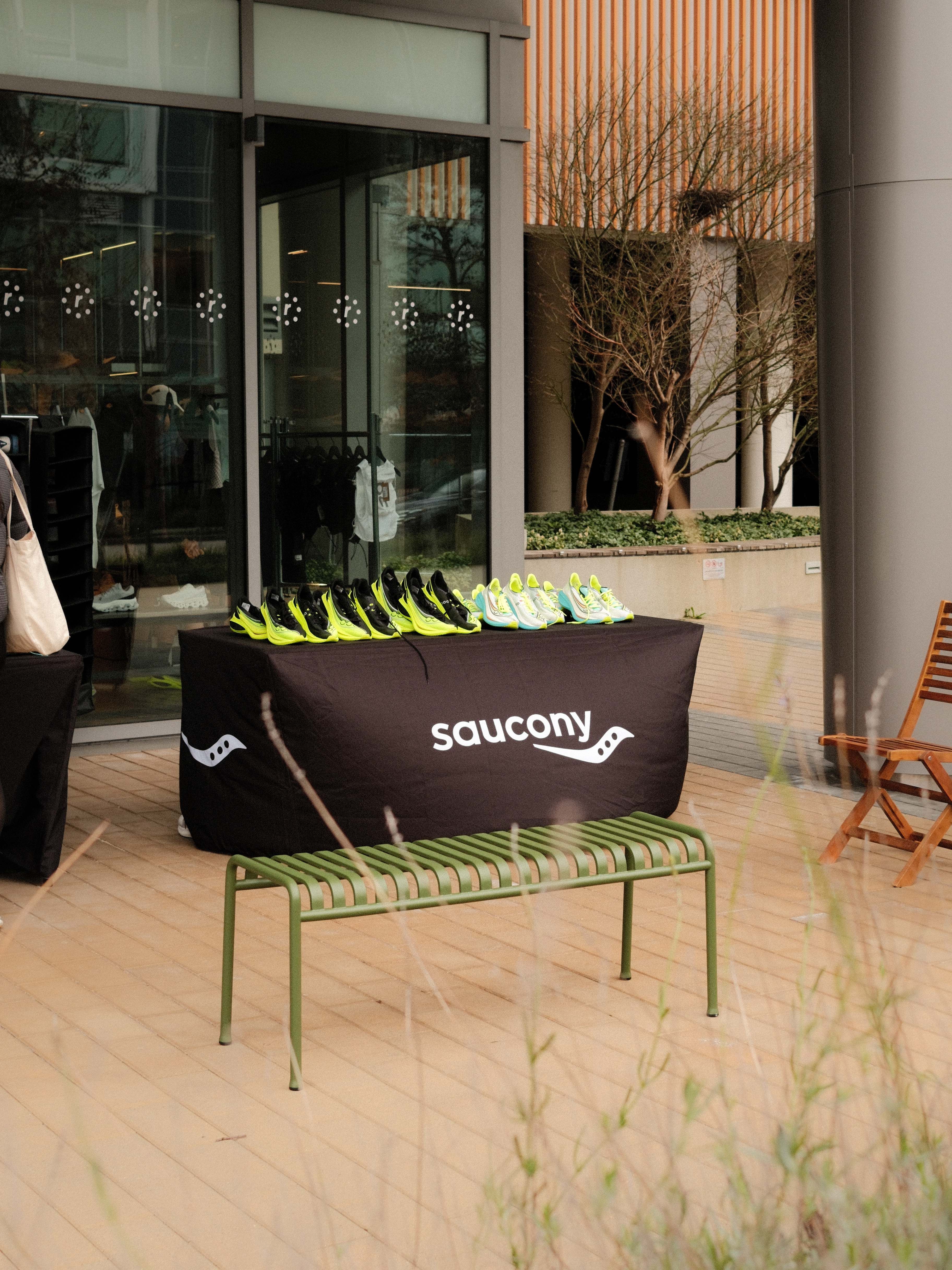 Saucony Running Shoe Table in front of Enroute.RUN