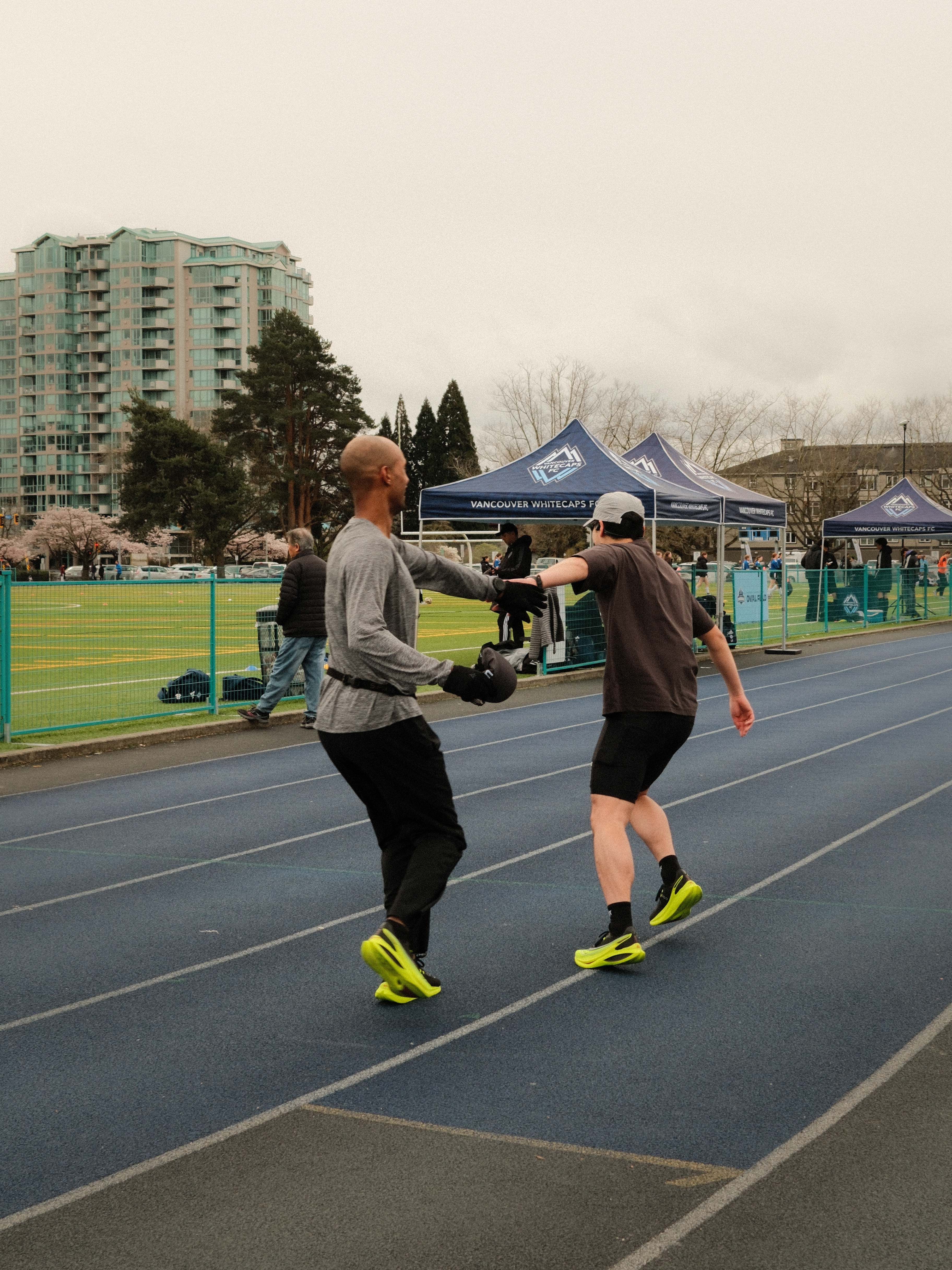 Runners tagging each other off wearing Saucony Endorphin Pro