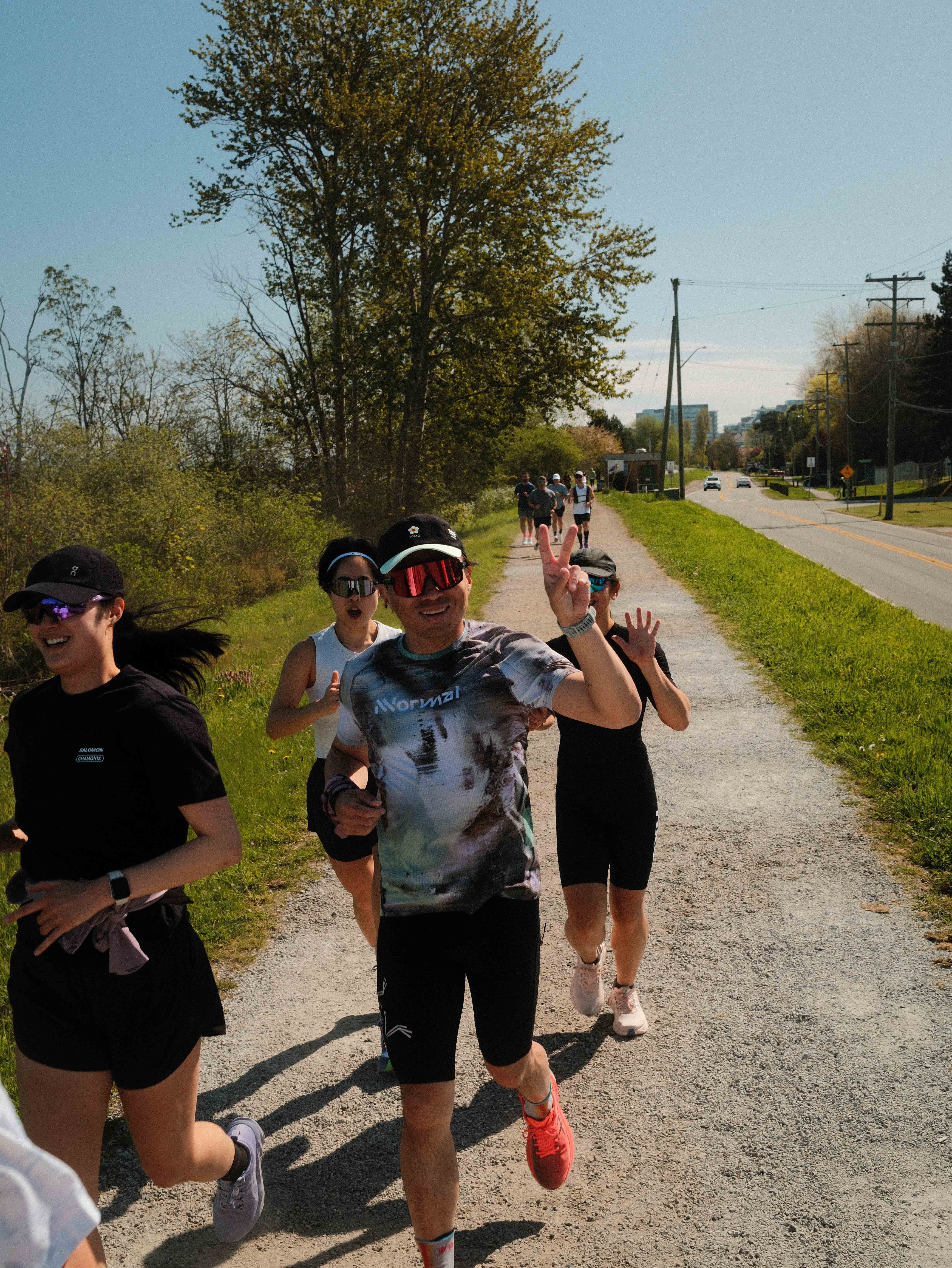 Runners smiling while running in Asics Running Shoes