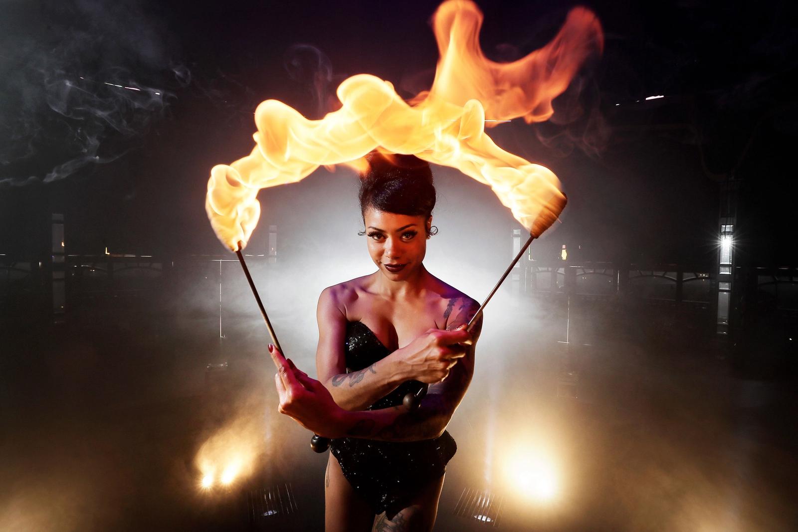 Heather Holliday with flaming batons