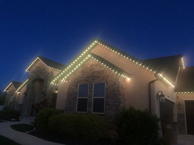 Warm white down lighting on a stone gable