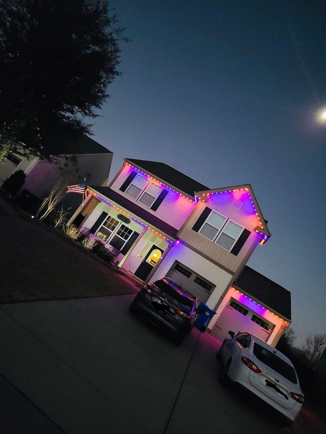 A two-storey brick home in red, white and blue