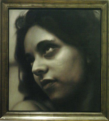 Photorealism painting of devoted woman slightly enigmatic in frame.