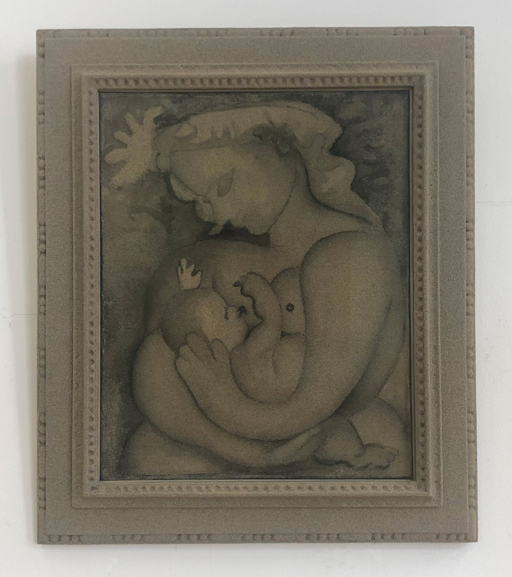 Quartz sand artwork with varying shades forming a frame; depicts a mother and child, inspired by a Pablo Picasso drawing.