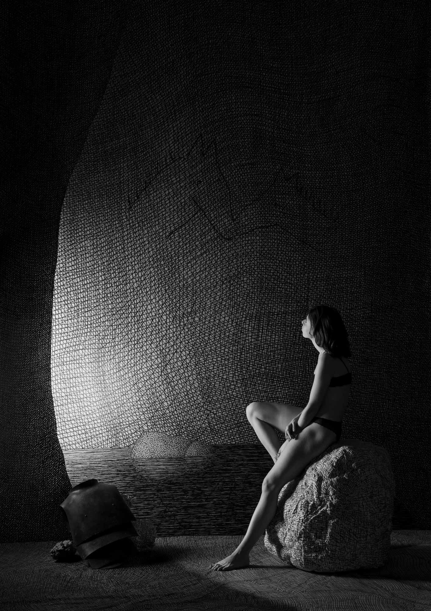 Girl sits on rock next to a pool of water in a cave looking up at wall drawing of two horses kissing.