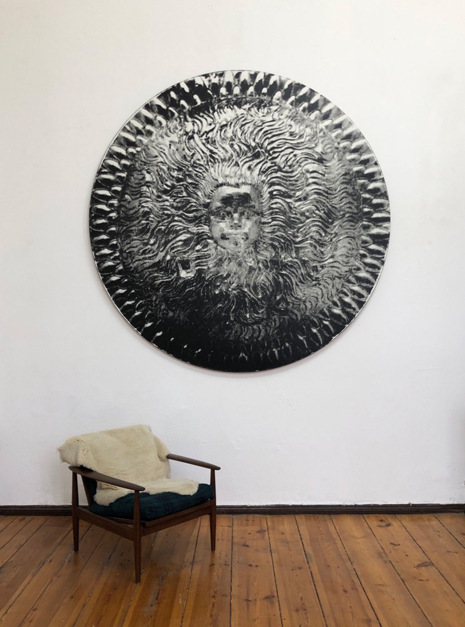 Oil on round canvas painting of a child's face in centre of Greek battle shield. (White version)