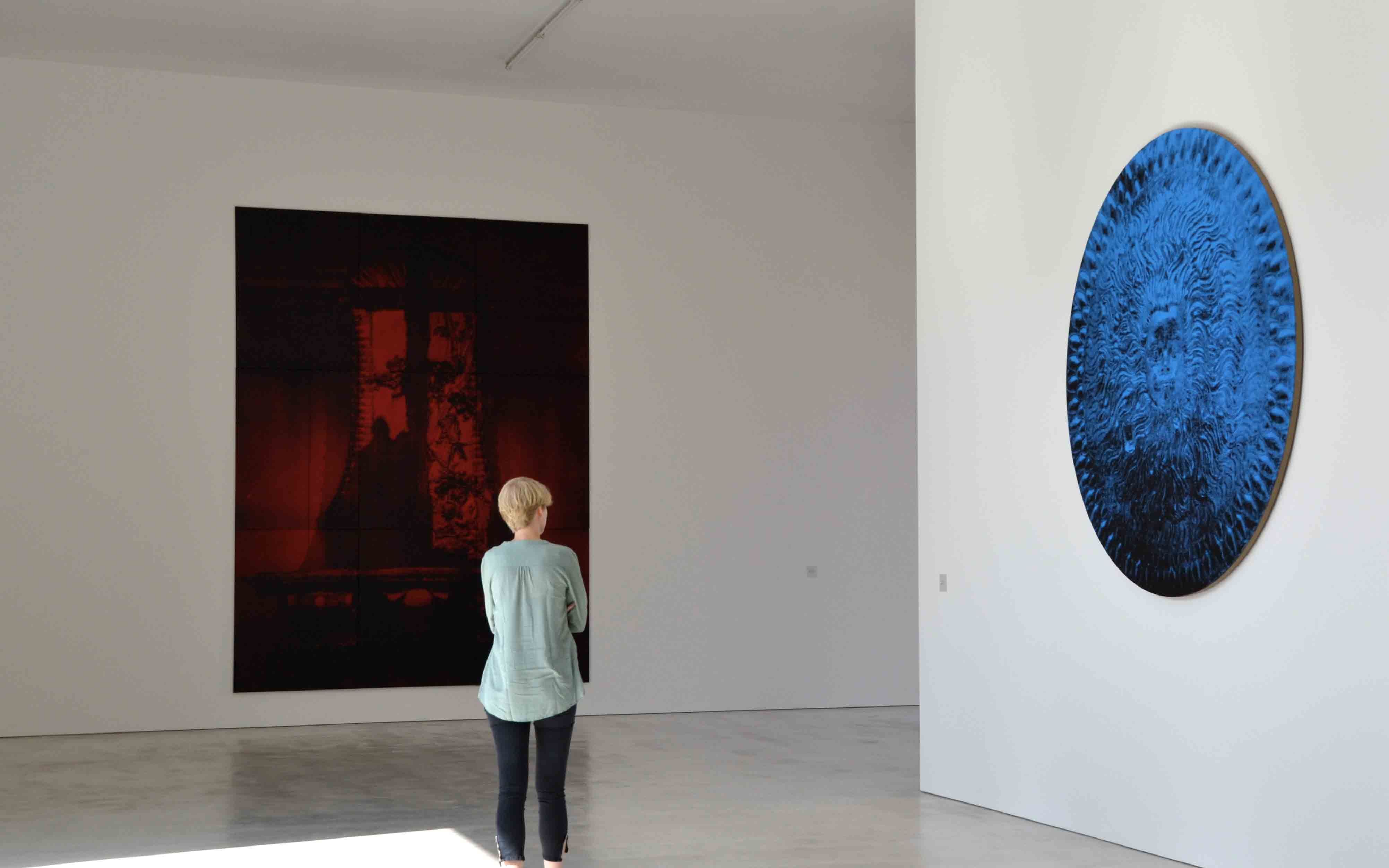 Woman looking at art in Bastian Gallery, Berlin.