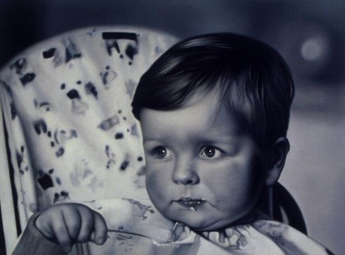 Photo realistic Self portrait of artist Mark Alexander at six months eating with spoon.