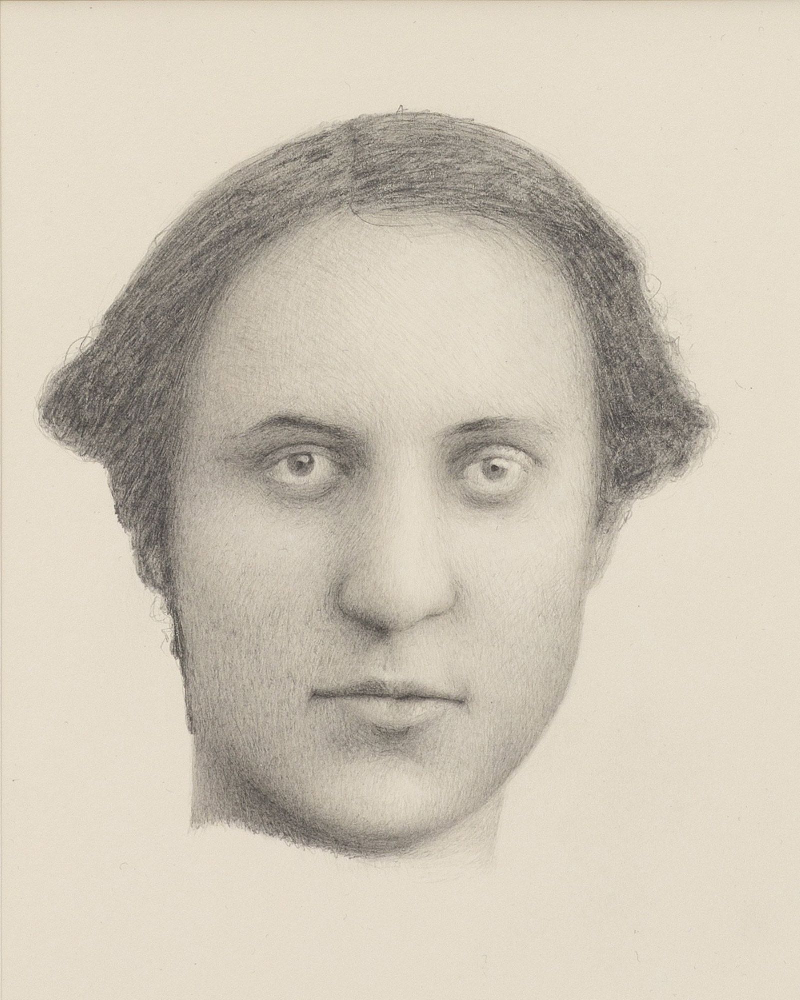 Detailed pencil portrait capturing deep-set eyes, defined lips, and wavy hair framing the face.
