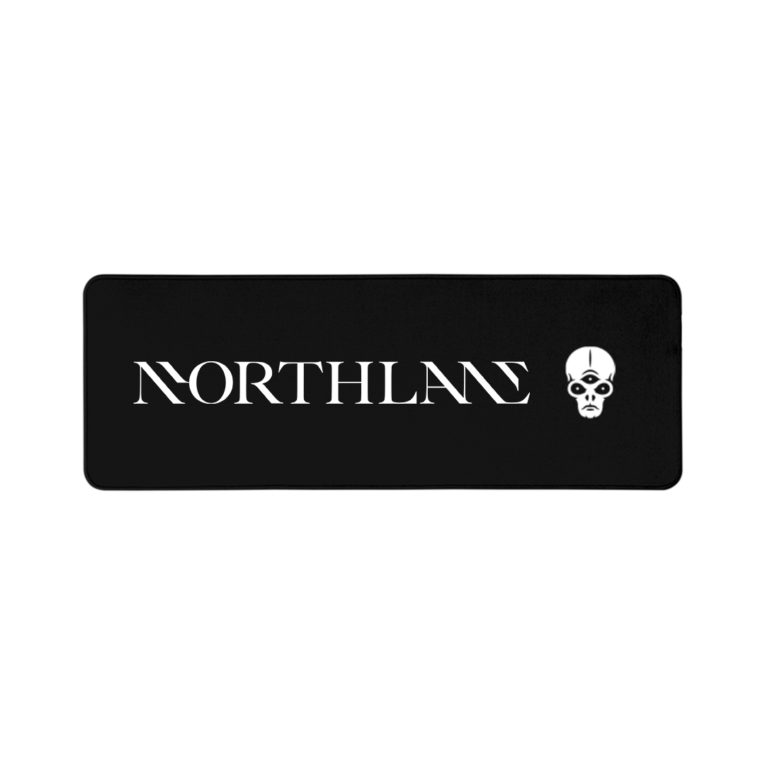 Black desk pad with rounded corners, the Northlane logo centered, to the right an aliens head with three eyes.