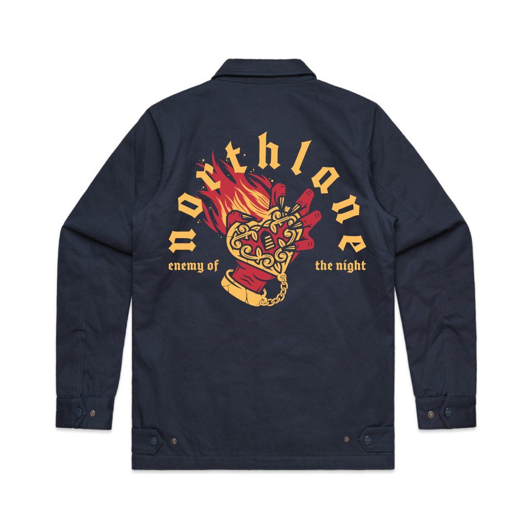 A waist length navy blue collared jacket with padded lining. In large print on the back a red hand holds a flaming heart. Arched over the print reads Northlane, and underneath reads enemy of the night.