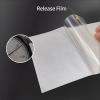 Peeling clear release film from reflective HTV vinyl layer with thickness measurement