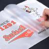 Peeling back screen printed heat transfer PET film sheet after heat pressing onto fabric