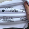 Custom heat transfer care label with washing instruction symbols printed on white garment