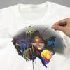 Hand peeling PET film after applying custom iron on transfer to a white cotton t-shirt