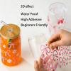 Applying 3D effect pink ribbon bow UV DTF transfer wrap on a 16 oz glass beer can cup