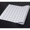 Sheet of custom printed reflective heat transfer film displaying repeated logo designs for apparel printing