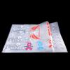 Custom multi-color heat transfer PET film sheet displaying vibrant logo designs for apparel printing