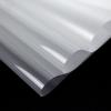 Peeling clear carrier sheet from a custom 3D high density silicone reflective heat transfer dragon logo on fabric