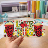 Holding a custom "LOVE BUG" ladybug patterned UV DTF transfer film sheet for glass cup decoration