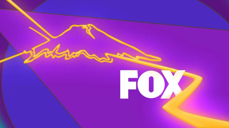 Stylized neon gold light beam in the shape of Mount Fuji against an abstract purple background with the "FOX" logo on the bottom right of image.
