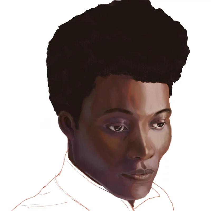 three-quarter face pose of black man with afro updo