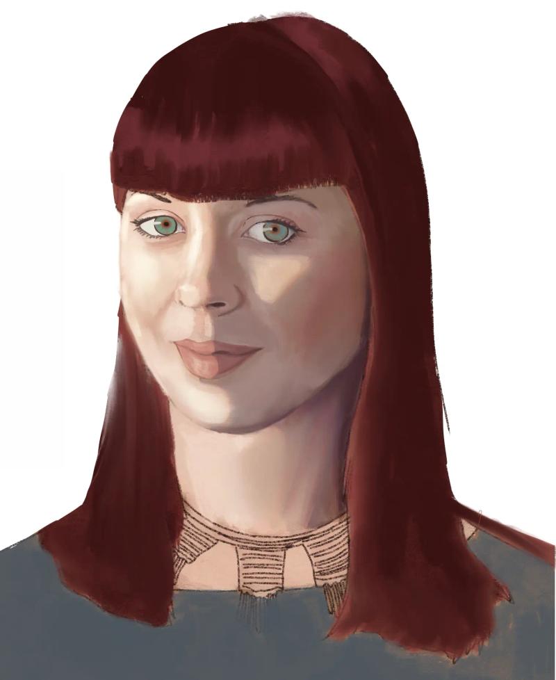 woman with shoulder length red hair looking forward