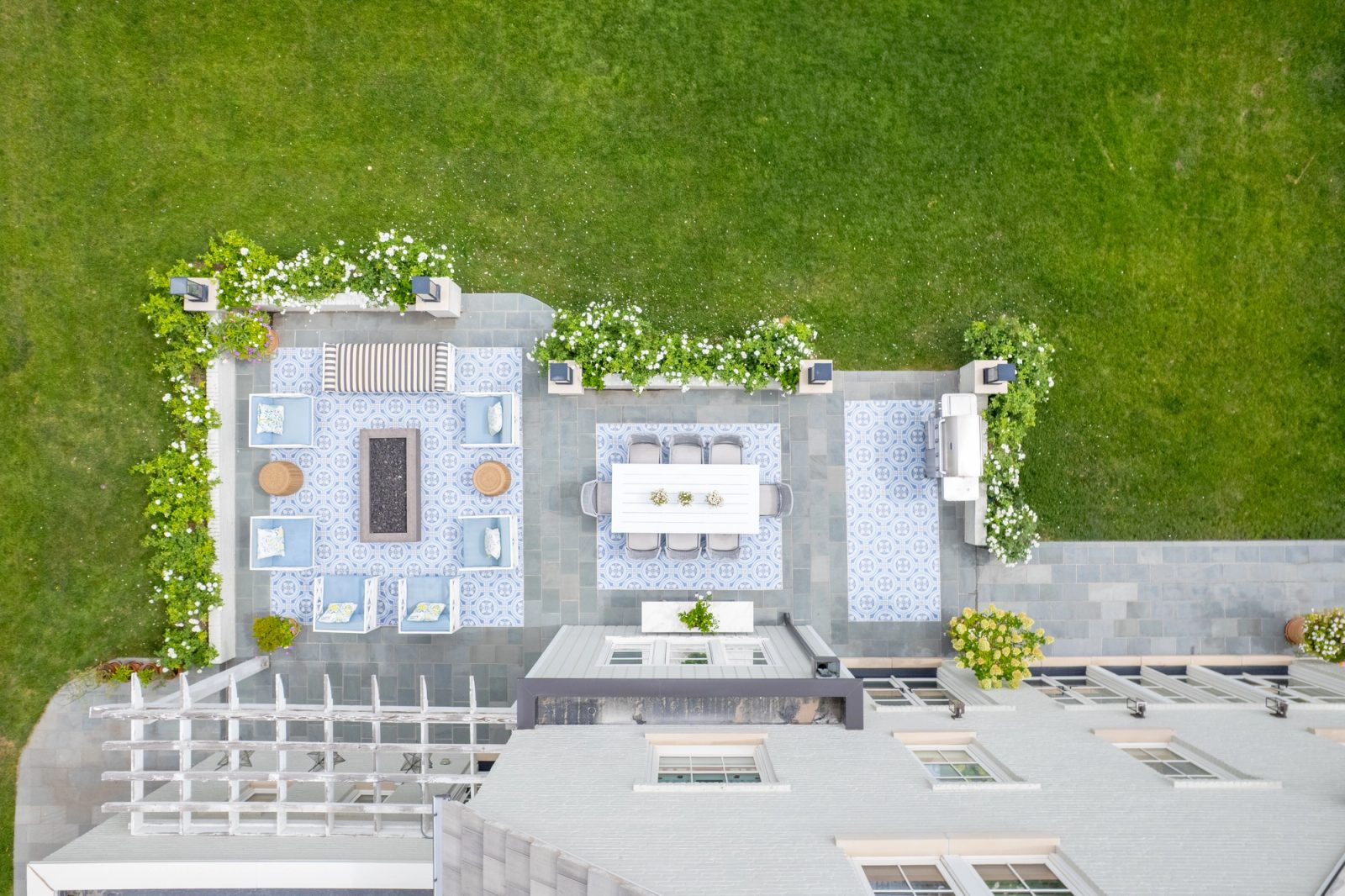 Aerial view of a backyard patio with lounge and dining areas.
