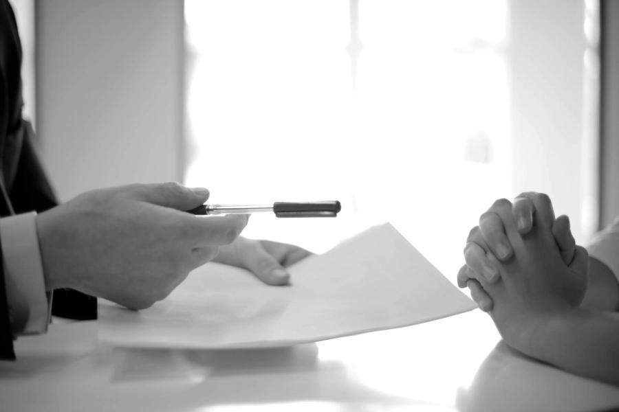 A document passed across a table