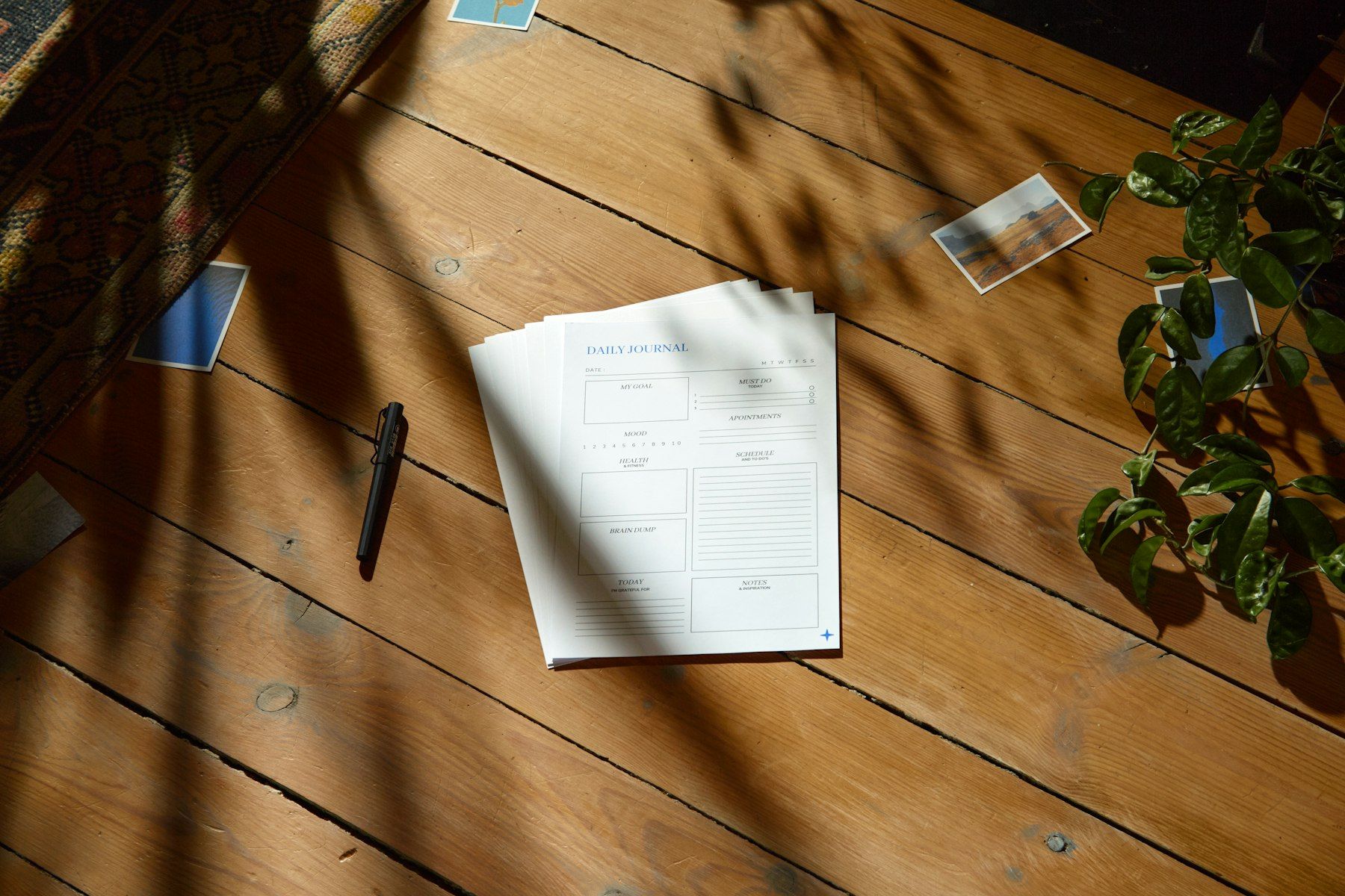 A single written page on a sunlit wooden table