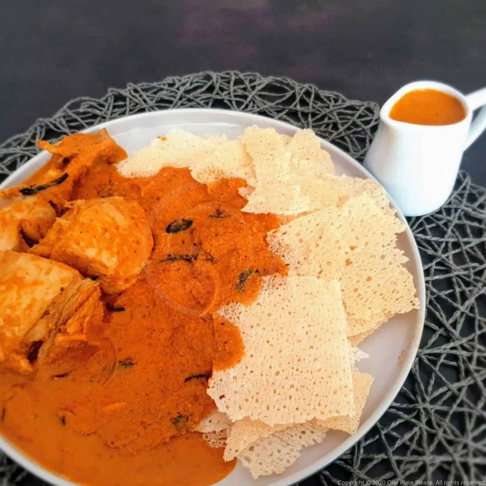 Authentic Kori Gassi — Mangalorean coconut chicken curry served over crispy Kori Rotti rice wafers, Coastal Karnataka style