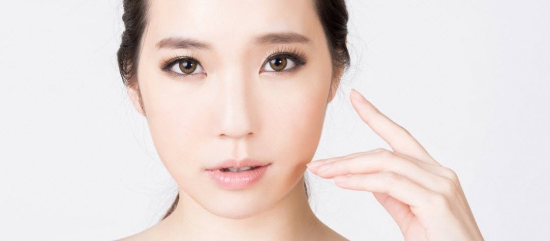 Asian woman with asymmetrical eyebrows 