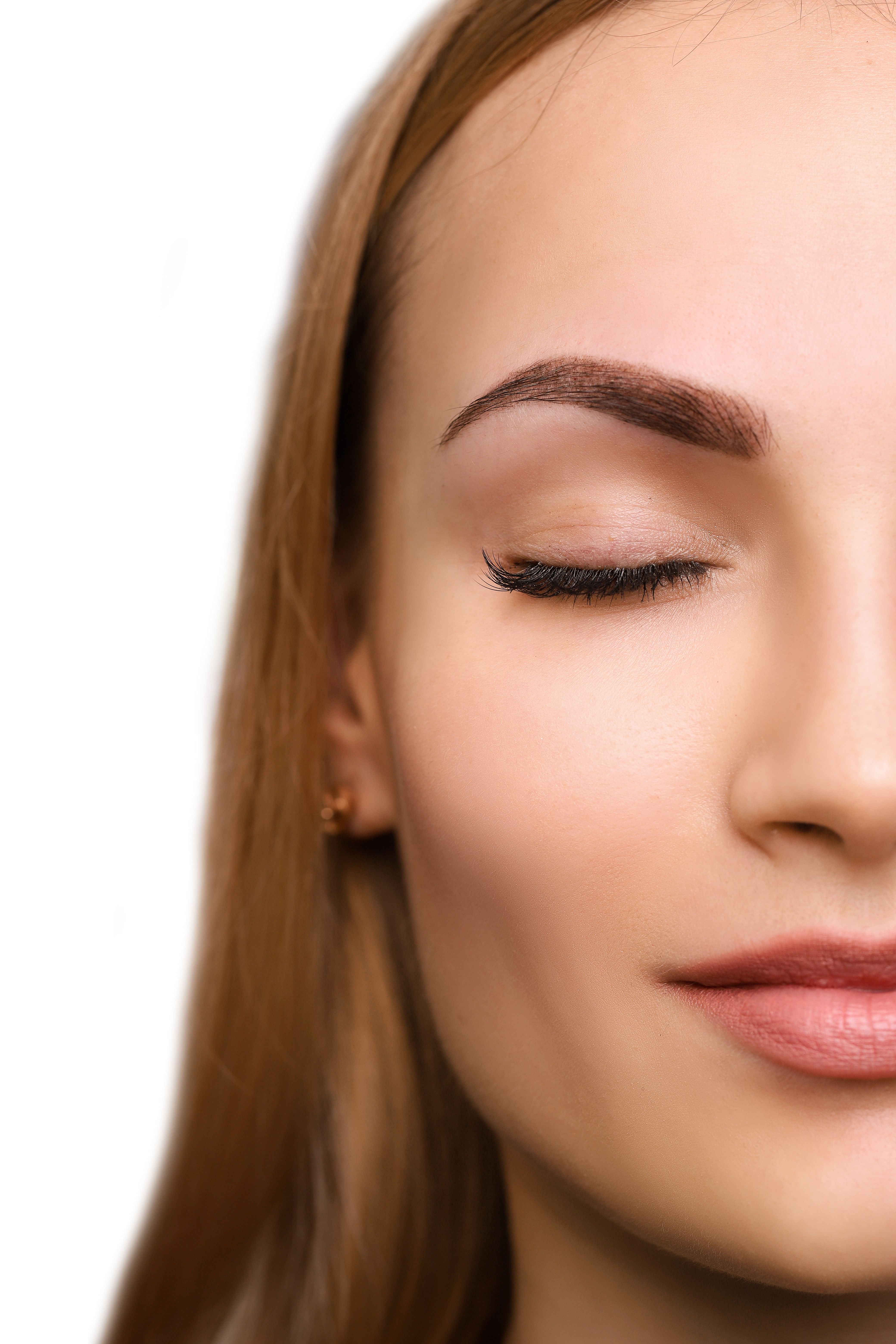 Woman with powder filled eyebrows without harsh front or outlines
